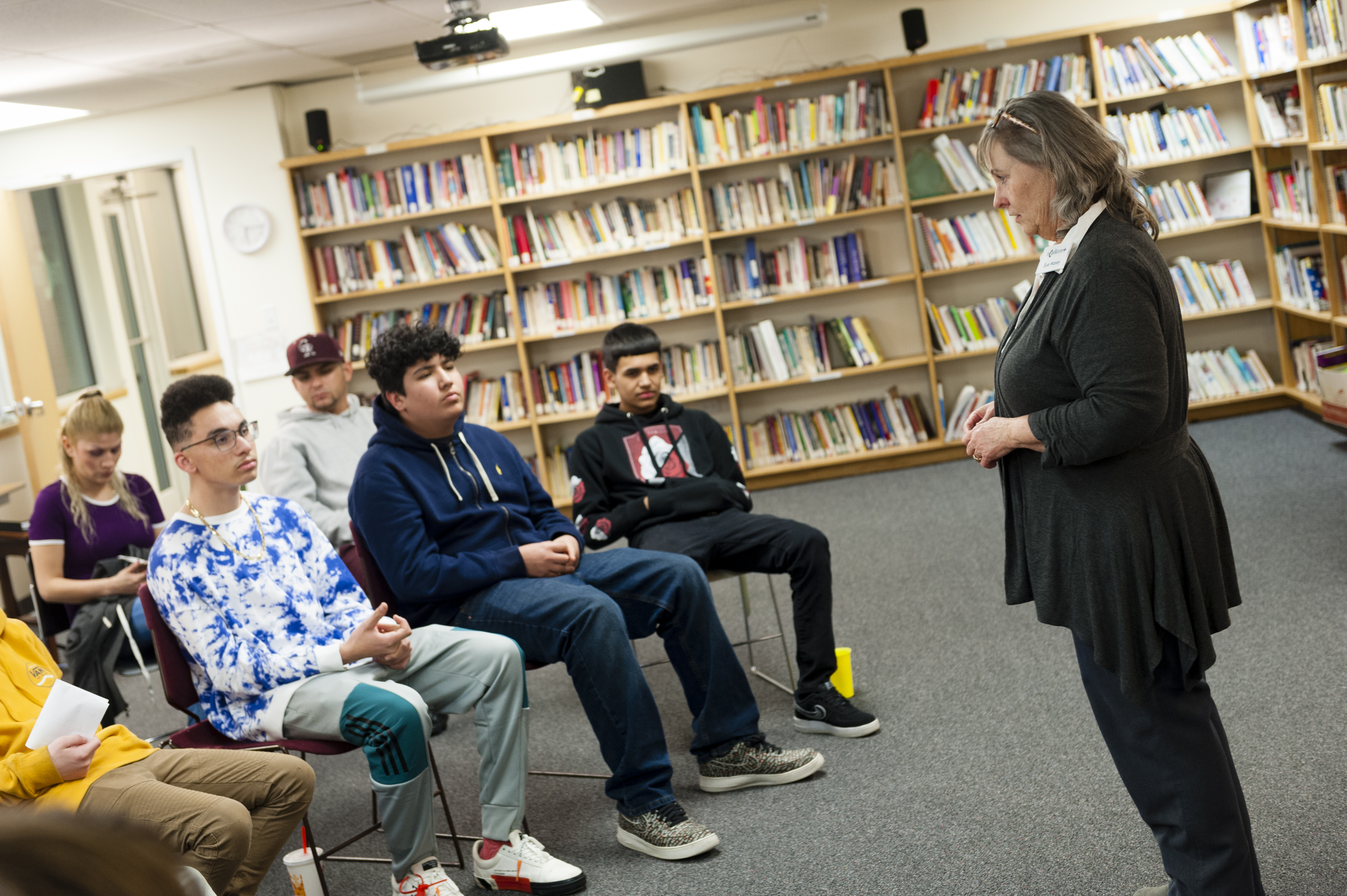 Woman Talking to High School Students